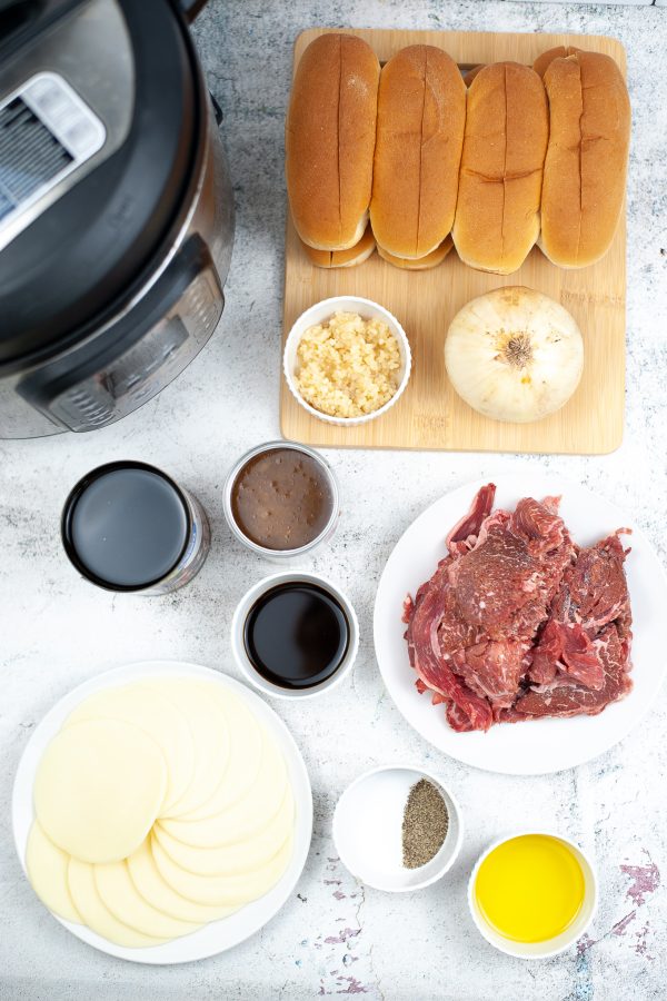 Ingredients needed for French dip sandwiches in front of an Instant Pot